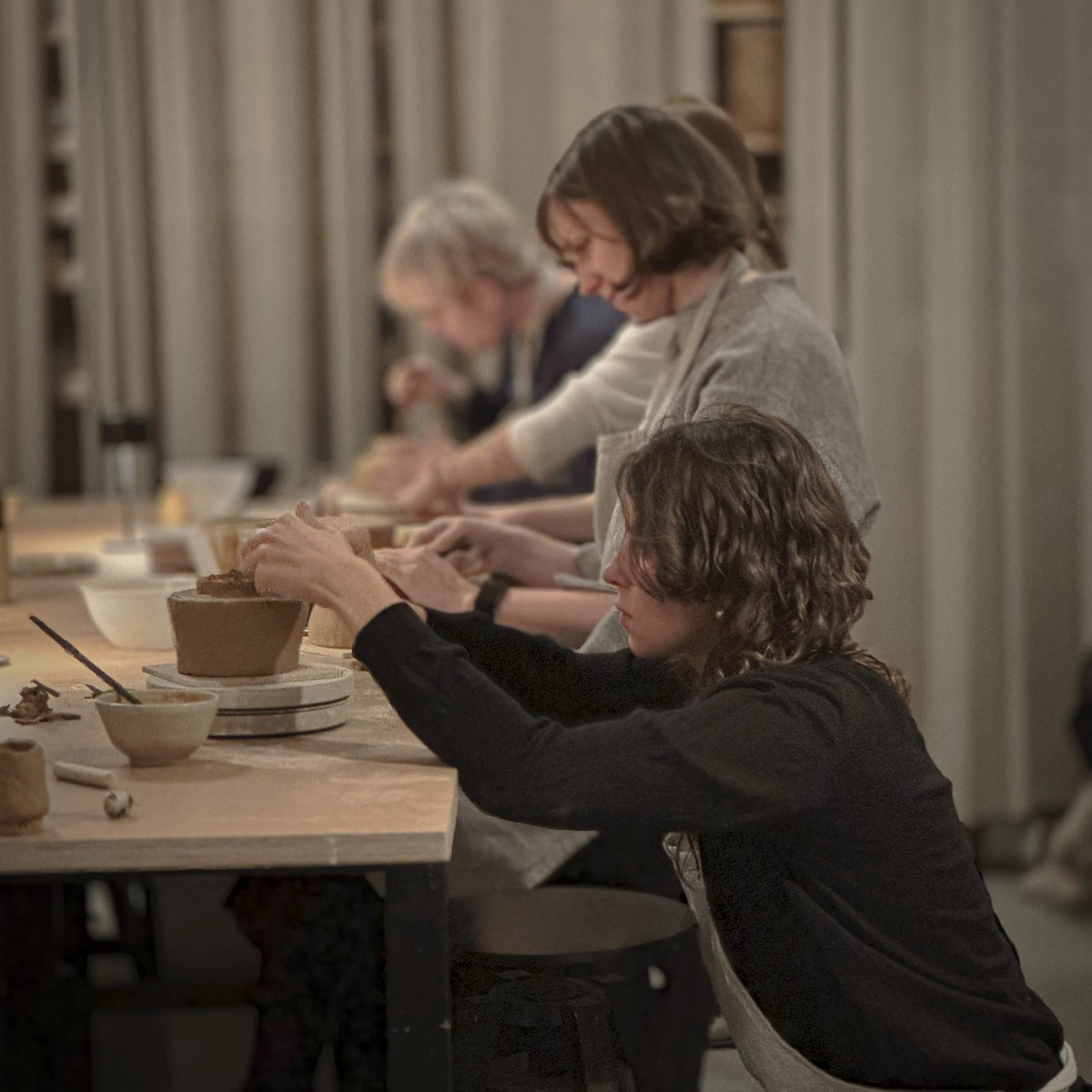 Whisking matcha at the clay workshop